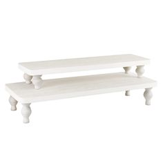 two white wooden benches sitting side by side on top of each other in front of a white background