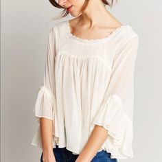 Babydoll Style Blouse- Super Comfortable With Light Breathable Fabric. Fits True To Size! If You Are A Bit More Blessed In The Just Area I Would Size Up! White Flowy Cotton Blouse, Flowy White Cotton Blouse, White Bohemian Top With Ruffles, White Feminine Peasant Top With Ruffles, White Ruffled Peasant Top For Brunch, White Casual Blouse With Lace Trim, Casual White Blouse With Lace Trim, White Flowy Cotton Tops, Feminine Flowy Cream Blouse