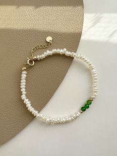 "✿ Sold individually ✿ Material: 3-4mm Natural Freshwater Pearls  2-3mm Natural Diopside ✿ Finish: 14K Gold Filled Fingdings ✿ Size: Approx. 5 5/8 inches with 1 inches adjuster ✿Tarnish resistant, hypoallergenic, safe for sensitive skin ✿Shop the collection: https://www.etsy.com/listing/1382755555/ ✿ P L E A S E   N O T E: All of our freshwater pearls are all-natural and unique, therefore each shape is slightly different and won't exactly be like in the picture.  Meanwhile, there may be measurem Elegant May Birthstone Beaded Bracelets, Elegant Hand-strung May Birthstone Beaded Bracelets, Elegant Hand-strung May Birthstone Bracelets, Elegant May Birthstone Bracelets, Elegant Green Pearl Bracelet With Natural Stones, Elegant Hand-strung Green Beaded Bracelets, Elegant Green Hand-strung Beaded Bracelets, Dainty Green Bracelets With Round Beads, Dainty Green Round Bead Bracelets