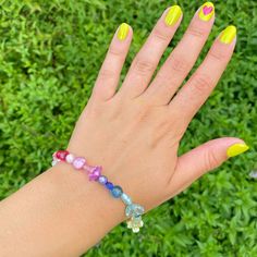 This bracelet is the perfect accessory to brighten up any outfit with its cheerful hues of the rainbow! It can add an easy pop of color to an ordinary outfit or add some character to a more bright and fun outfit. Have fun layering with other bracelets of varying lengths- made easy by the 2.5 in adjuster chain, allowing you to wear this bracelet looser or tighter. You can also purchase separately a matching ring and/or necklace from my shop to complement the necklace (shown all together in the la Craft Beads, Matching Ring, Rainbow Beads, Matching Rings, Bead Crafts, Beaded Flowers, The Rainbow, Beaded Bracelet, Have Fun