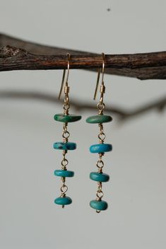 These earrings are beautiful and unique. They are a perfect addition to any outfit.  Each turquoise heishi bead was hand picked and wire hand formed to create the beautiful tiered style of these earrings.Thank you for supporting my small business! :)<3 Stephanie Turquoise Bohemian 14k Gold-filled Earrings, Turquoise 14k Gold Filled Bohemian Earrings, Bohemian Turquoise 14k Gold-filled Earrings, Bohemian Turquoise 14k Gold Filled Earrings, Turquoise Gold Bohemian Earrings, Bohemian 14k Gold-filled Beaded Dangle Earrings, Bohemian 14k Gold Filled Beaded Dangle Earrings, 14k Gold-filled Turquoise Jewelry With Ear Wire, Turquoise 14k Gold-filled Earrings With Ear Wire