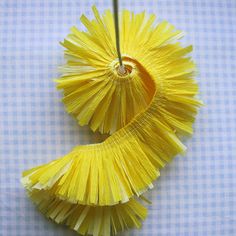 two yellow pieces of paper hanging from a hook