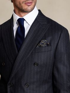 Break through the bitter winter in sophisticated style, thanks to this expertly tailored suit jacket crafted from super 120s Italian wool flannel, a luxurious fabrication that is lightweight yet warm to carry you through cooler climes.  TAILORED SLIM Grey Flannel Suit, Italian Bespoke Suits, Professional Double-breasted Business Suit, Luxury Fall Suits With Suit Collar, Luxury Suits With Suit Collar For Fall, Luxury Business Casual Suits For Fall, Luxury Business Casual Fall Suit, Luxury Fall Business Casual Suit, Luxury Fall Suits With Notch Lapel