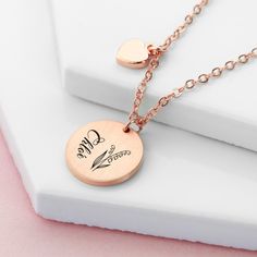 Treat her to a stylish and meaningful gift with our beautiful Personalised Birth Flower Brushed Heart and Disc Necklace. With its unique design, this necklace is perfect for any occasion. Whether you gift it to your mum this Mother’s Day, your girlfriend on Valentine’s or treat a loved one on their birthday, this outstanding piece of women’s jewellery will make the perfect gift for her. Personalise with your loved one’s name and their birth flower - both will be meticulously engraved onto the pendant by our personalisation exports - creating a truly one-of-a-kind gift that will hold real sentimental value to her. Alongside this will be a cute little heart pendant, representing your love - she’ll forever hold it close to her heart. Your necklace will come beautifully nestled inside in a sle Rose Gold Charm Necklace For Mom On Valentine's Day, Rose Gold Charm Necklaces For Mom On Valentine's Day, Valentine's Day Rose Gold Charm Necklace For Mom, Heart-shaped Charm Necklace With Flower For Gift, Heart-shaped Flower Charm Necklace For Gift, Feminine Rose Gold Charm Necklace For Gift, Feminine Rose Gold Charm Necklace As Gift, Feminine Rose Gold Charm Necklaces Gift, Rose Gold Heart Necklace For Mother's Day