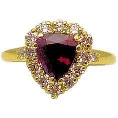 18 Karat Yellow Gold Pear Shape Ruby and Diamond Ring | From a unique collection of vintage Cocktail Rings at https://www.1stdibs.com/jewelry/rings/cocktail-rings/. Formal Ring With Trillion Cut And Accent Stones, Formal Rings With Accent Stones In Trillion Cut, Formal Trillion Cut Ring With Accent Stones, Fine Jewelry Yellow Gold Trillion Cut Ring, Heirloom Pear-shaped Diamond Ring With Gemstone, Trillion Cut Yellow Gold Rings For Formal Occasions, Heart Cut Multi-stone Diamond Rings, Luxury Trillion Cut Yellow Gold Rings, Luxury Trillion Cut Ring With Accent Stones