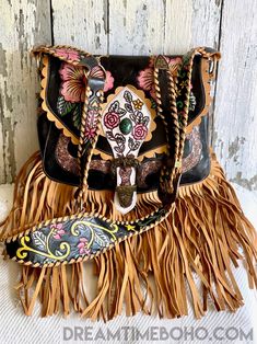 Be captivated by the exquisite hand-painted details of this heavenly Hibiscus Dream fringed boho bag crafted with genuine leather and an adjustable, hand painted crossbody strap. Make a bold statement with this alluring accessory and feel truly fabulous wearing this stunning artwork! Hand painted Genuine Leather Lined Hand painted Adjustable Shoulder Strap Measurements : Approx W33cm x H30cm tassels/fringe not included in measurements Zip Close with magnetic clasp on front flap & Inside bag has Bohemian Hand Painted Shoulder Bag For Everyday Use, Bohemian Leather Shoulder Bag With Detachable Strap, Bohemian Shoulder Bag With Detachable Strap, Bohemian Hand Tooled Crossbody Bags, Boho Leather Bags, Leather Fringe Bag, Hippie Look, Bohemian Bags, Witch Fashion