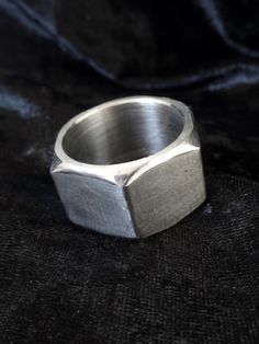 "A unisex industrial hexagonal stainless steel ring made of a real hardware nut. A wide, chunky, geometric band with an edge to it. Perfectly smooth inside. The ring is 5/8\" (1.6 cm) wide. US sizes available for this width are 11 - 14. Sizes 6 - 10.5 are available here: https://www.etsy.com/listing/101123948 Sizes 4.5 - 5.5 are available here: https://www.etsy.com/listing/464852845 All photos show the ring in US size 13. Keep in mind that the smaller the ring size (in this particular size range Etsy Rings, Hex Ring, Industrial Ring, Gold Hex, Hexagon Engagement Ring, Texture Jewelry, Funky Rings, Hexagonal Ring, Wire Crochet Jewelry