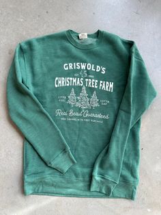 Perfect for the holiday season, this new arrival from OAT Collective features their best selling sweatshirt silhouette complete with a festive Griswold Tree Farm graphic front + center. Crew neck silhouette Super soft fabrication Holiday graphic 50% Cotton, 50% Polyester Measures approx. 27" from a S. Model is wearing a S. Blank Sweatshirts, Forest Style, Love Now, Tree Farm, Christmas Tree Farm, Tree Farms, Authentic Louis Vuitton, Gucci Bag, New Arrival