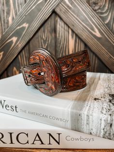 A full tooled leather belt with matching leather buckle. A statement to any outfit. 100% Leather Belt Width: 1.5" Small 32" | 30"-34" Medium 36" | 34" - 38" Large 40" | 38" - 42" **All measurements are taken from top of the belt to the first and then to the last hole** Buckle can be removed Western Brown Embroidered Belt, Brown Embroidered Belt Buckles For Western-themed Events, Leather Belt With Embroidery For Western-themed Events, Embroidered Leather Belt For Western-themed Events, Leather Embroidered Belt For Western-themed Events, Embroidered Brown Belt Buckle For Rodeo, Hand Tooled Leather Belts For Western-themed Events, Adjustable Hand Tooled Brown Belt, Adjustable Hand-tooled Brown Belt