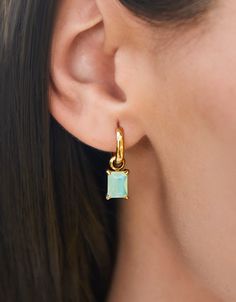 Our classic Emerald Drop Earrings complement your elevated style with stunning sea foam blue crystals. Designed to shine through everyday wear, exercise, showers and a summer at the beach in tarnish-free 14kt gold vacuum plating. Bonus, remove the drop for a simple gold hoop. 2-looks-in-1! Summer At The Beach, Emerald Earrings Drop, Spartina 449, Elevated Style, Stainless Steal, Shine On, To Shine, Gold Hoop, Blue Crystals