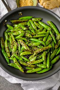 green beans with sesame seeds in a skillet