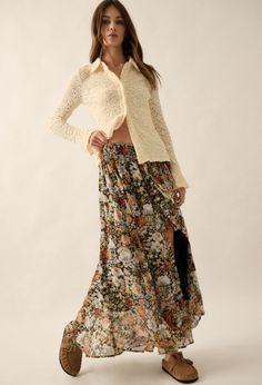 Expertly crafted with a smocked elastic waistband, the 'Fall Foliage Skirt' boasts a high waist and tie detail for a flattering fit. The playful floral print adds a touch of whimsy while the button down front closure provides a secure and stylish finish. Content & Care: 100% Polyester Hand wash cold Floral Print Skirted Bottoms For Fall, Bohemian Gathered Skirt Bottoms For Day Out, Bohemian Gathered Skirt For Day Out, Elastic Waistband Bottoms For Spring Garden Party, Bottoms With Elastic Waistband For Spring Garden Party, Bottoms With Elastic Waistband For Garden Party In Spring, Skirted Floral Print Bottoms For Brunch, Fitted Tiered Skirt For Garden Party, Casual Fitted Bottoms For Garden Party