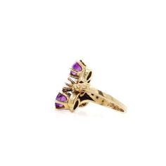 A fine toi et moi gold, amethyst, and pearl cocktail ring.  Size 2.  In 14 karat yellow gold.  The gold setting with a flower to either side of the stones and with decorative rivets/beading.  Set two round cut amethysts with a pearl in the center of the trio of stones. The amethysts have inclusions.  Simply a wonderful ring!  Date: 20th Century  Overall Condition: It is in overall good, as-pictured, used estate condition with some fine & light surface scratches and other signs of expected light wear consistent with age.  Fineness: Marked 14k for gold fineness.   Marks: Marked 14k to the shank.   Ring Size: ca. 2  Gemstone Measurements: 2 Amethyst: ca. 5.5mm diameter x 3.25mm height 1 Pearl: ca. 4mm diameter  Measurements: Height: ca. 17mm Width: ca. 18mm Depth: ca. 21mm  Weight: ca 3.3 g Multi-stone Amethyst Ring In Yellow Gold, Vintage 14k Gold Multi-stone Amethyst Ring, Vintage Multi-stone Amethyst Ring In 14k Gold, Heirloom Multi-stone Purple Amethyst Ring, Fine Jewelry Yellow Gold Marquise Amethyst Ring, Marquise Yellow Gold Amethyst Ring Fine Jewelry, Anniversary Yellow Gold Three-stone Amethyst Ring, 14k Gold Multi-stone Purple Amethyst Ring, Yellow Gold Three Stone Amethyst Ring