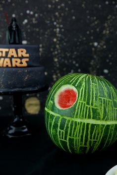 a watermelon carved to look like a star wars helmet