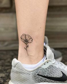 a small flower on the ankle is shown in black ink, with a white background