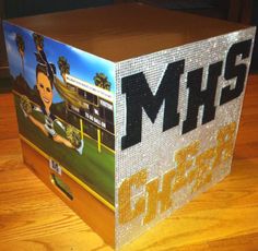 a box with the words mshs on it sitting on top of a wooden table