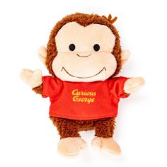 a stuffed monkey wearing a red shirt with curious george written on it's chest