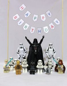 a star wars birthday party with legos and cake toppers, including darth vader