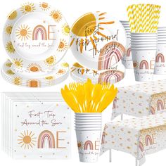 an assortment of party supplies including plates, cups and napkins