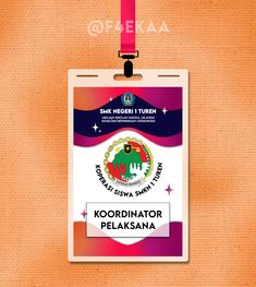 an id badge is hanging from a lanyard with a pink ribbon around it and the words kordinator pekasana