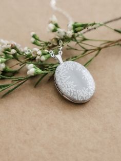 Gray Pendant Jewelry For Gifts, Gray Pendant Jewelry As A Gift, Elegant White Oval Pendant Locket Necklace, Gray Pendant Necklace Gift, White Round Locket Necklace For Keepsake, White Locket Necklace For Memorial, White Sterling Silver Engraved Locket Necklace, White Oval Pendant Necklace With Locket, Sterling Silver White Engraved Locket Necklace