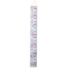 a white ruler with pink flowers on it