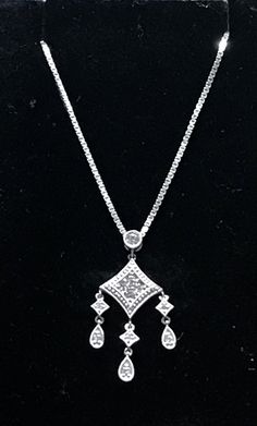 "Solid 14K White Gold Diamond Pendant Necklace 18\" My ex purchased this for me from a jeweler in NYC and it was EXPENSIVE!! STUNNING diamond pendant crafted beautifully in 14k White gold and genuine diamonds! The pendant measures approximately 1 1/4 long x 1/2\" wide. Chain is a nice weight box chain, 18\" long. 4.6 grams total weight. GREAT DEAL!! Please message me with any questions Shipped insured/delivery confirmation I guarantee item to be exactly as described and pictured." Diamond-shaped Necklace With Diamond Accents, Fine Jewelry Diamond-shaped Necklace With Diamond Accents, Fine Jewelry Diamond Necklace With Accents, Formal Diamond-shaped Necklace With Diamond Accents, Hallmarked Diamond Pendant Necklace, Diamond Cut Pendant Necklace, Hallmarked Diamond White Pendant Necklace, Classic Diamond Cut Drop Pendant Necklace, Classic Diamond Cut Diamond-shaped Necklace