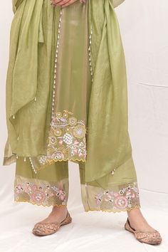 Green kurta with thread embroidered floral motifs, pearl sequin, floral applique embellishments and scalloped borders. Comes with culottes, undershirt and dupatta. - Aza Fashions Green Floral Embroidered Cotton Silk Dupatta, V-neck Wedding Sets With Floral Embroidery, Green Cotton Silk Anarkali Set With Floral Embroidery, Designer Tissue Silk Kurta For Spring, Pista Green Cotton Silk Sets With Floral Embroidery, Traditional Cotton Silk Sharara For Spring, Spring Designer Tissue Silk Kurta, Pista Green Tissue Silk Set With Intricate Embroidery, Pista Green Embroidered Tissue Silk Sets