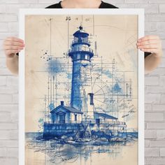 a woman holding up a blue and white poster with a drawing of a lighthouse on it