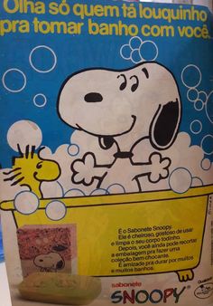 an advertisement for snoopy soap with a dog in the bathtub and bubbles on it