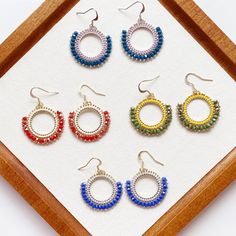 Add a statement piece to your accessory collection with these stunning Hoop Boho style handmade earrings. Crafted using a Brick stitch beaded technique, these earrings feature circle Miyuki Delica seed beads that add a pop of color and texture. Elevate your look with this beautiful beadwork earring that is sure to turn heads wherever you go. These unique earrings will make a statement and add a touch of bohemian flair to any outfit. Handmade with love and attention to detail, these earrings are perfect for those who appreciate artisanal jewelry. Each seed bead has been individually woven with crystal clear durable nylon braided beading thread  Closure: Ear hook Length: 1.8 inches Width:1.4 inches Quantity:1 pair Bohemian Crystal Earrings For Jewelry Making, Handmade Crystal Hoop Earrings For Gift, Handmade Small Hoop Crystal Earrings, Handmade Bohemian Crystal Hoop Earrings, Handmade Bohemian Crystal Earrings, Bohemian Small Hoop Beaded Earrings For Party, Handmade Hoop Chandelier Earrings As Gift, Bohemian Wire Wrapped Round Crystal Earrings, Bohemian Handmade Crystal Earrings For Party