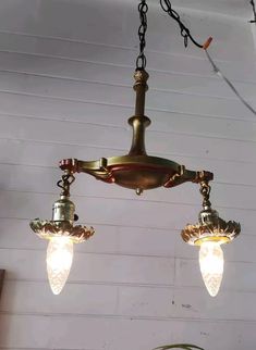 three light fixtures hanging from the ceiling