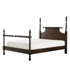 a wooden bed frame with white sheets and wood posts on the headboard, in front of a white background