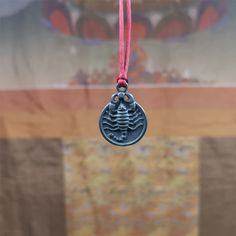 ❤This scorpion amulet is made by Tibetan craftsmen in Hepo Township, Baiyu County, the birthplace of the famous Tibetan handicrafts.It is made of thokcha, size is 0.8 inches.You can make it into a necklace, or a keychain, or just put it in your shrine.❤Details: 100% Handmade Pendant material:thokcha Pattern: scorpion guru Height: 28mm /1.1 inches Diameter: 22mm /0.8 inches ❤Free Gift : Cowhide Cord Color:Black Length:68cm / 26.8inches Width:4mm / 0.16inches You'll get 1 scorpion amulet as pictur Traditional Good Luck Medallion Necklace, Traditional Medallion Necklace For Good Luck, Traditional Round Pendant Necklace For Good Luck, Adjustable Amulet Necklace With Oxidized Finish, Adjustable Amulet Necklace For Ceremonial Occasions, Adjustable Amulet Necklace, Symbolic Handmade Ceremonial Necklaces, Traditional Adjustable Locket Necklace, Adjustable Engraved Necklaces For Rituals