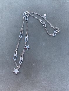 Add a touch of luck to your jewelry collection with this beautiful Sterling Silver 925 Lucky Charm Shooting Star Necklace. Designed with a unique charm, this necklace is perfect for any occasion. The necklace is made of high-quality Angel A brand sterling silver and comes in a designer gift box. The necklace features a charming shooting star charm and is perfect for those who love unique and stylish jewelry. With a metal purity of 925, this necklace is a great addition to any fine jewelry collec Dainty Charm Necklace Gift, Sterling Silver Paperclip Chain Jewelry Gift, Silver Paperclip Chain Jewelry For Anniversary, Silver Jewelry With Paperclip Chain For Anniversary, Anniversary Silver Jewelry With Paperclip Chain, Silver Star Charm Jewelry For Anniversary, Star Charm Jewelry Gift, Silver Jewelry With Star Charm For Anniversary, Silver Charm Necklaces As Gift For Her