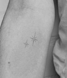 a small star tattoo on the thigh