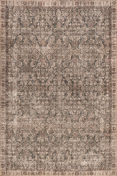 an antique style rug with many different colors and patterns on the carpet, including brown, beige