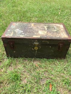 an old suitcase sitting in the grass