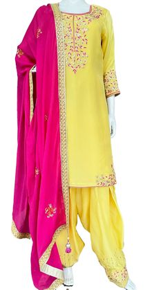 Lime yellow and pink upada silk suit. Kurta: Salma, sequins and thread work hand embroidery on neck and hem slits corners.  Sleeves having a wide border of embroidery. Fabric: Pure upada silk with shantoon lining. Salwar: Full flare Patiala Salwar made with 5 mtrs of fabric , with beautiful embroidery on hem /poucha .   Fabric: Pure upada silk Dupatta : Pure chinon pink color hand embroidery motif all over dupatta, with sequins border and matching handmade tassels. Width :40 inches Length : 2.25 Festive Yellow Semi-stitched Salwar Kameez, Yellow Dola Silk Kurta With Gota Work, Traditional Yellow Semi-stitched Salwar Kameez, Yellow Silk Anarkali Set With Resham Embroidery, Bollywood Style Yellow Chinon Sets, Yellow Silk Lehenga For Eid, Eid Yellow Chinon Traditional Wear, Yellow Dola Silk Kurta With Traditional Drape, Yellow Semi-stitched Raw Silk Kurta