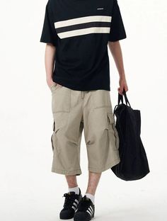 Embrace practicality with a touch of streetwise style in our Cargo Pocket Knee-Length Capri Shorts, designed for the modern man. Crafted with utmost attention to detail, these knee-length shorts feature a robust fabric blend that's pre-washed for a lived-in feel. The multiple cargo pockets not only enhance the utilitarian appeal but also add a layer of functionality, perfect for keeping your essentials at hand. The straight, loose fit ensures ease of movement and comfort throughout your day. Whe Shorts Y2k, Capri Shorts, Knee Length Shorts, Cargo Pocket, Modern Man, The Modern, Knee Length, Capri, Loose Fitting