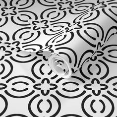 black and white wallpaper with an intricate design on it's surface, in the middle