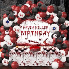 an image of a birthday party with balloons and blood on the table in front of it