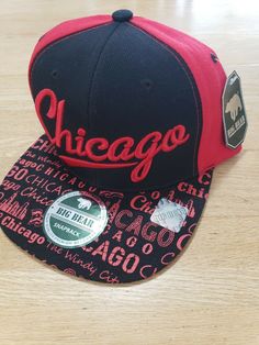 Selling this Big Bear Chicago snapback hat. Colors on it are a mix of red and black. This is new with tags as shown in the photos. Was never used, if even at all. Hat is in amazing condition. Pictures are of the actual snapback hat you will receive no stock photos here. Thanks for looking :) Chi Town, Big Bear, Chicago Bears, Hat Cap, Snapback Hat, Red And Black, Snapback Hats, New Black, Trucker Hat