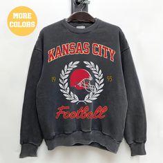 Perfect sweatshirt for Kansas City football fans this season! Ideal for any situation, a unisex heavy blend crewneck sweatshirt is pure comfort. These garments are made from polyester and cotton. This combination helps designs come out looking fresh and beautiful. The collar is ribbed knit, so it retains its shape even after washing. There are no itchy side seams on these sweaters.  .: 50% cotton, 50% polyester .: Medium-heavy fabric (8.0 oz/yd² (271.25 g/m .: Loose fit .: Sewn-in label .: Runs College Team Logo Hoodie With Crew Neck, College Crew Neck Hoodie With Team Logo, College Hoodie With Team Logo, Collegiate Style Sweatshirt For Football Season, Crew Neck Hoodie With Team Logo, College Crew Neck Sweatshirt With Team Logo, Team-colored Crew Neck Sweatshirt With Team Logo, Sports Season Team Logo Crew Neck Sweatshirt, Sports Season Crew Neck Sweatshirt With Team Logo