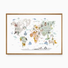 the illustrated map of the world with animals on it, framed in a wooden frame