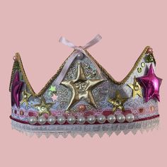 a tiara with stars and pearls on it