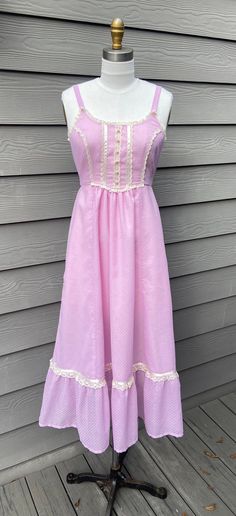 "This adorable dress is made from a genuine vintage Gunne Sax dress pattern.  It is made with vintage pink swiss dot voile fabric and trimmed in cream ribbon and lace. Invisible zipper back closure. Ribbon Tie at Waist. Dress is fully lined in pink acetate lining (just like the original Gunne Sax dresses!) Size is approximately an an XS or a 2/4. Bust: 32\" Waist: 25.5\" Length from Shoulder to Hem 49\" Ready to Ship! This dress may be returned within 7 days of delivery for a $5 restocking fee." Gunne Sax Dress Pattern, Gunne Sax Pattern, Boho Dress Formal, Harajuku Dress, Vintage Gunne Sax Dress, Blue Ruffle Dress, Sax Dress, Gunne Sax Dress, 1970s Dresses