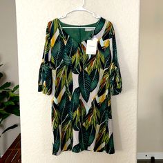 Belongsci From Amazon. Shift, Mini Dress With Bell Sleeves. Size Small. Fabric Is 96% Polyester, 4% Spandex. Zipper Closure On Back. V-Neck, Three Quarter Sleeve. Casual Green Leaf Print Dress, Casual Green Dresses With Leaf Print, Casual Green Dress With Leaf Print, Casual Green Midi Dress With Tropical Print, Yellow Shift Dress For Vacation, Yellow V-neck Dress With Tropical Print, Yellow Tropical Print Brunch Dresses, Swiss Dot Dress, Shift Mini Dress