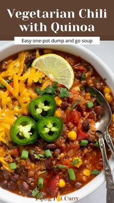 vegetarian chili with quinoa in a white bowl with a spoon on the side