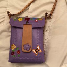 About 8x6 Lavender Purple Cross Body Purse. Painted With Flowers And A Butterfly. Closed With A Magnetic Button. Made In Mexico And Never Used. Leather Cross Body Purse, Purple Cross, Cross Body Purse, Purple Leather, Leather Crossbody Purse, Leather Cross, Lavender Purple, A Butterfly, Purses Crossbody